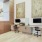a room with a desk and chairs