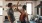 a man and a woman dance in well lit kitchen