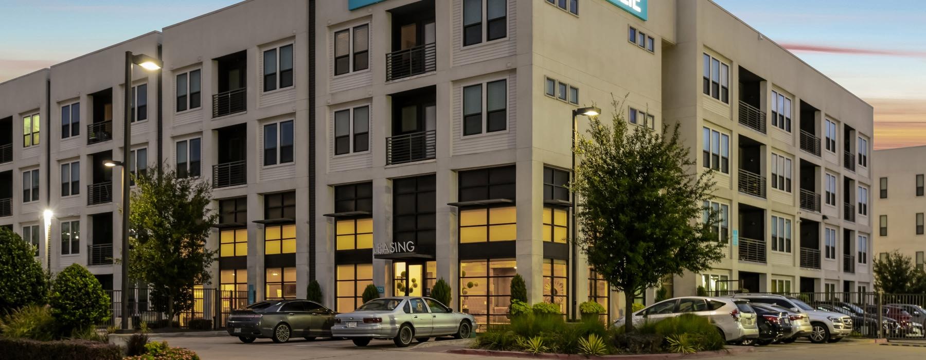 a building with cars parked in front