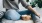 woman sits on a rug with a bowl of popcorn