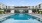 a swimming pool in front of a building