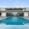 a swimming pool in front of a building