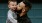 father holds and kisses his toddler son