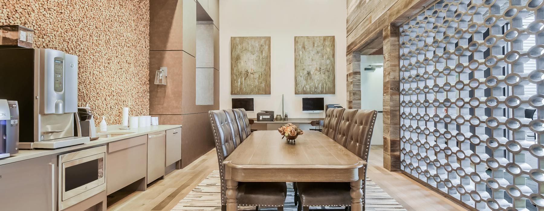 a dining room with a table and chairs