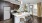 a kitchen with stools and a table